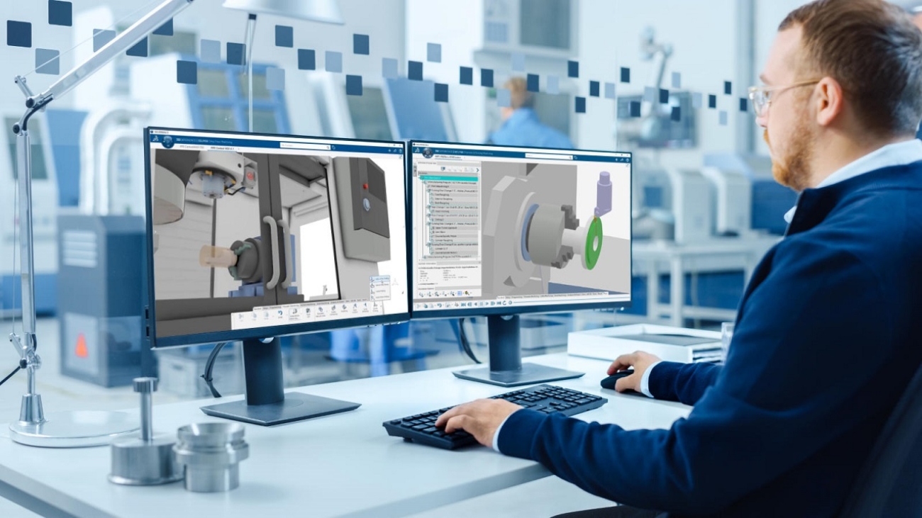 Industrial Engineer Working on a Personal Computer, Two Monitor